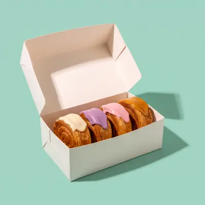Vier New York Rolls in einer Box zum Mitnehmen